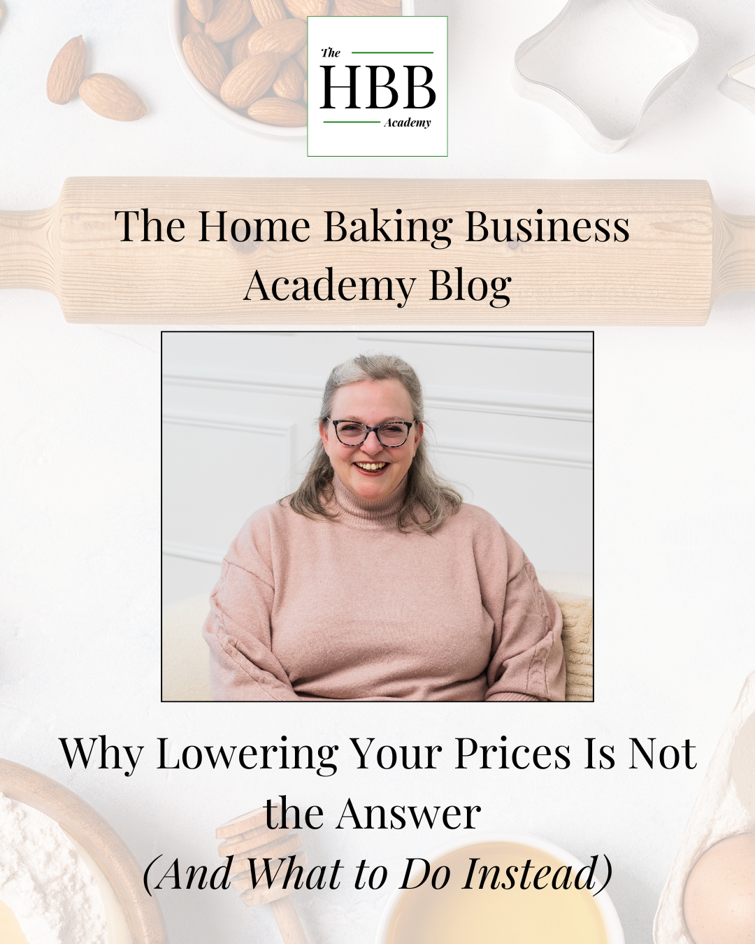 A woman with grey hair and glasses sits smiling in a bright, clean setting, wearing a pink jumper, with the HBB Academy logo, a wooden rolling pin, and baking ingredients in the background, overlaid with the blog title "Why Lowering Your Prices Is Not the Answer (And What to Do Instead)."